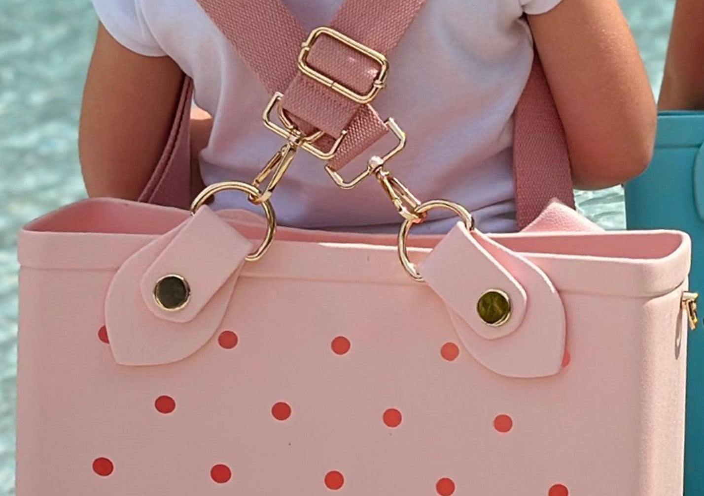 Quinn - Pink Notice the light gold hardware and custom anchors molded in colors to match our waterproof tote bags.